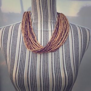 Wood beaded, multi-strand necklace.
